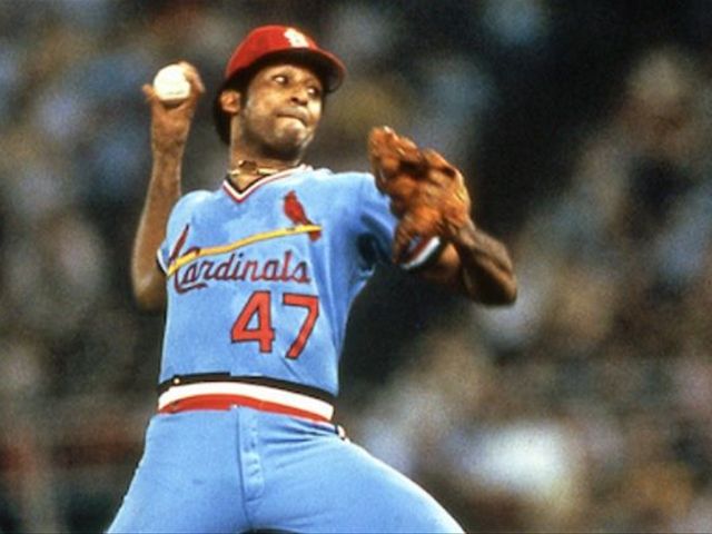 Pitcher Joaquin Andujar #47 of the St. Louis Cardinals is held by